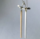 Handmade demi-fine dangle earrings resemble tori