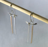 Handmade demi-fine dangle earrings resemble tori